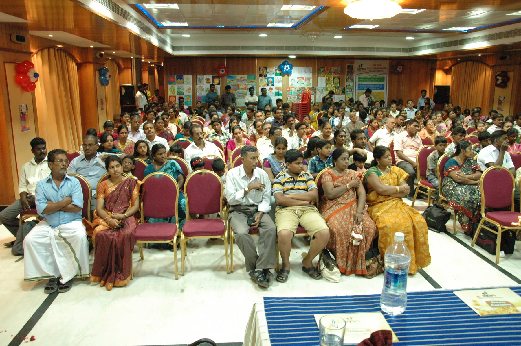 The community gathers for recognition, documented by The ART Foundation in 2012